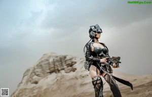 A woman in a futuristic outfit crouching down on the ground.