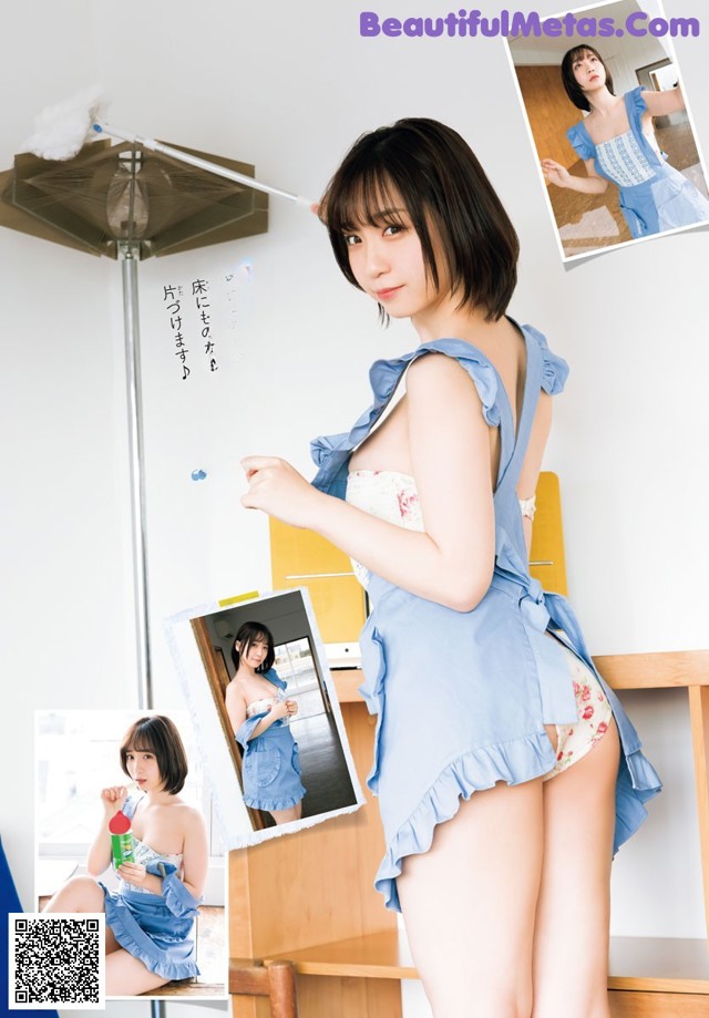 A woman in a blue dress is cleaning a desk.