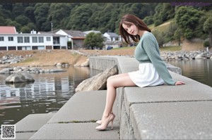 A woman in a white tank top posing for a picture.