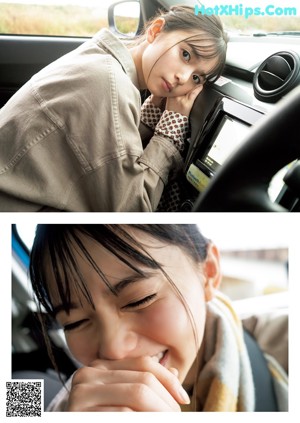 A little girl sitting at a table with her head resting on her hand.
