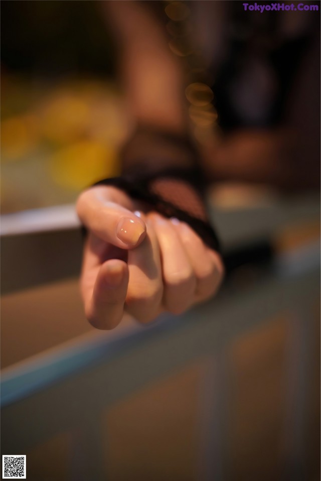 A close up of a person's hand pointing at something.